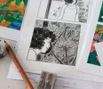 Photo d'un détail d'une planche en noir et blanc, entourée de test d'impression couleur.